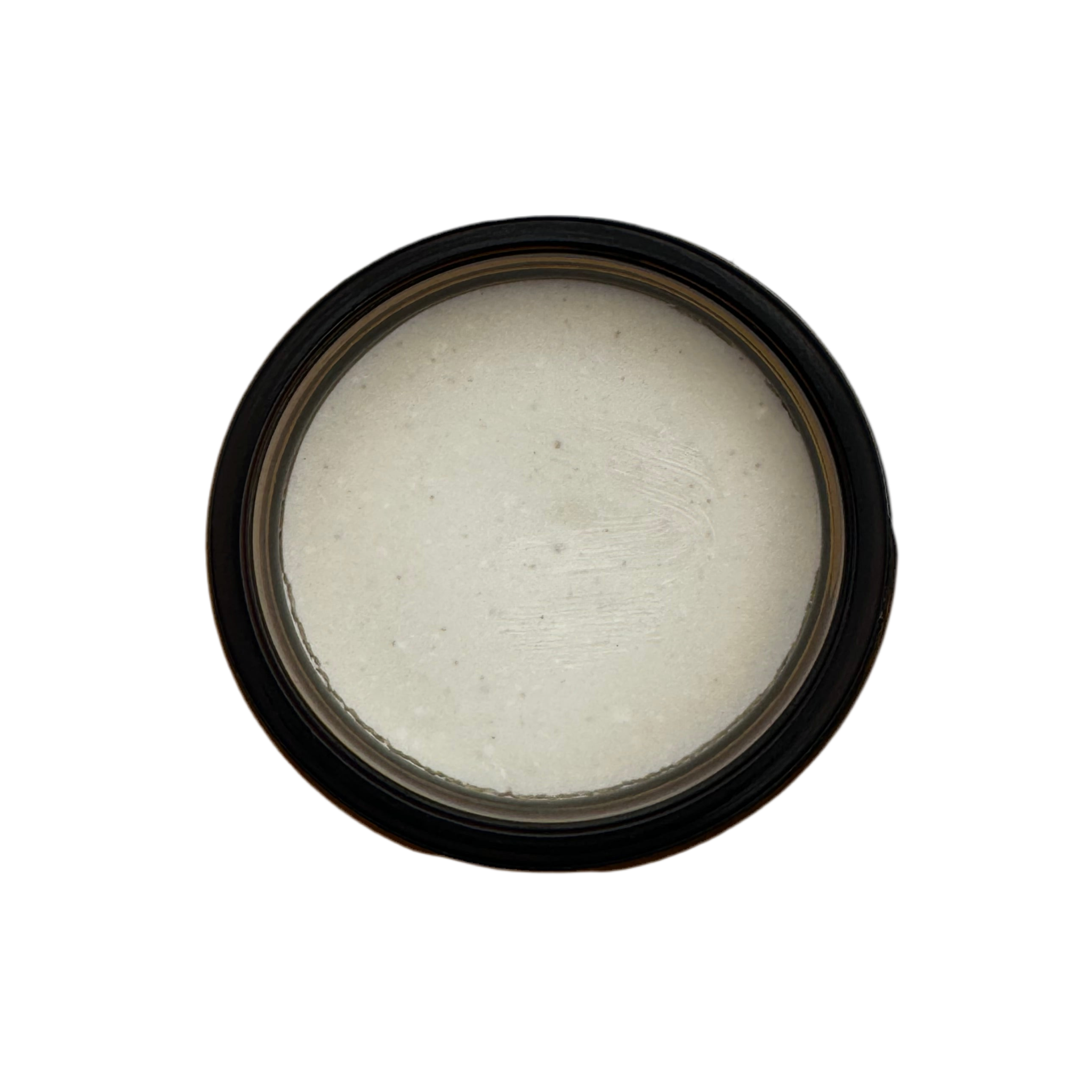 Top view of an open jar of Sedona Solar Shield, showing smooth, off-white tallow-based mineral balm with a creamy texture.