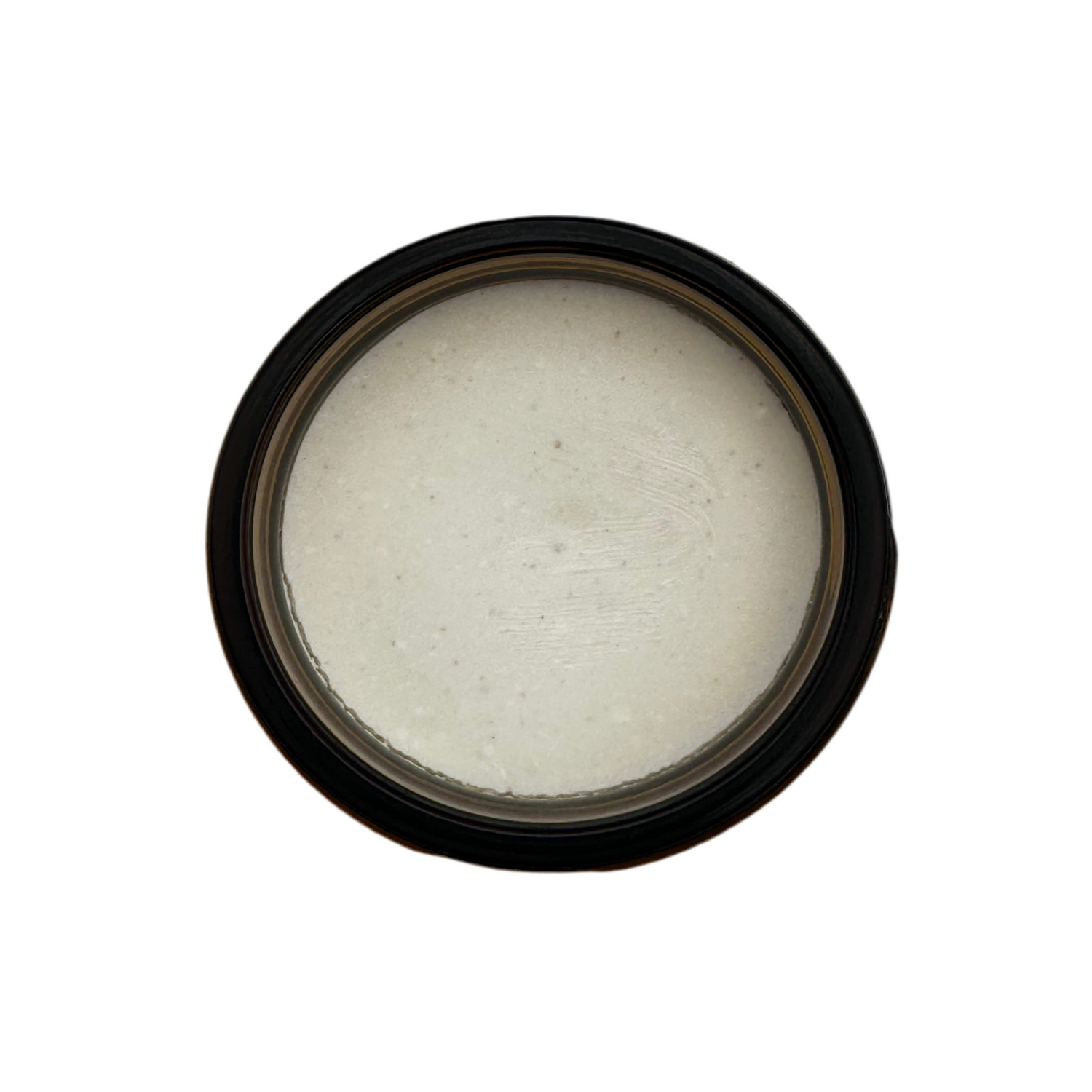 Top view of an open jar of Sedona Solar Shield, showing smooth, off-white tallow-based mineral balm with a creamy texture.