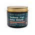 Amber glass jar of Sedona Solar Shield by Maloney Healing Remedies with gold metal lid, labeled as an unscented tallow-based balm with non-nano zinc oxide.